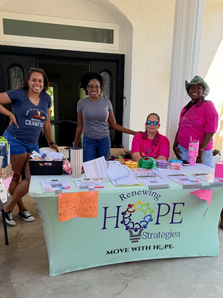 Volunteers at the welcome table at the Renewing Reins Grand Opening