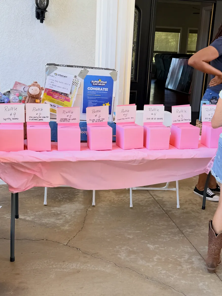 Raffle prizes set out on a table at the Grand Opening